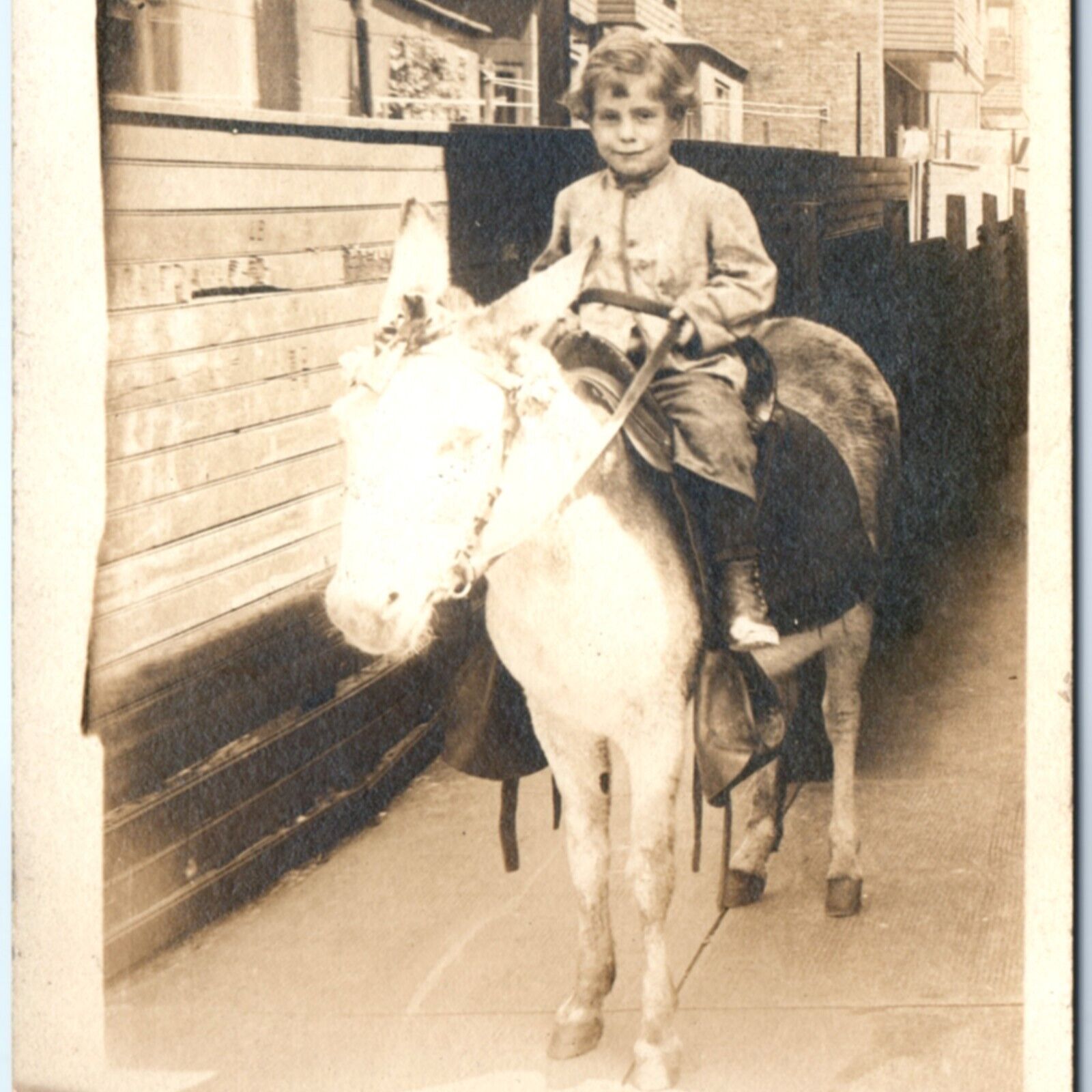 c1900s Cute Little Boy Riding Pony RPPC Town Alleyway Mature Real Photo PC A135