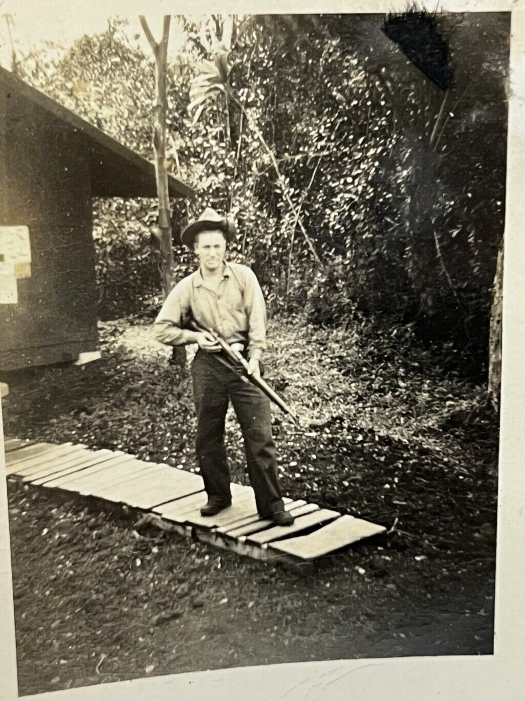 Old Vintage Photo Man Standing On A Wooden Walk Holding Gun Hunting Hunter