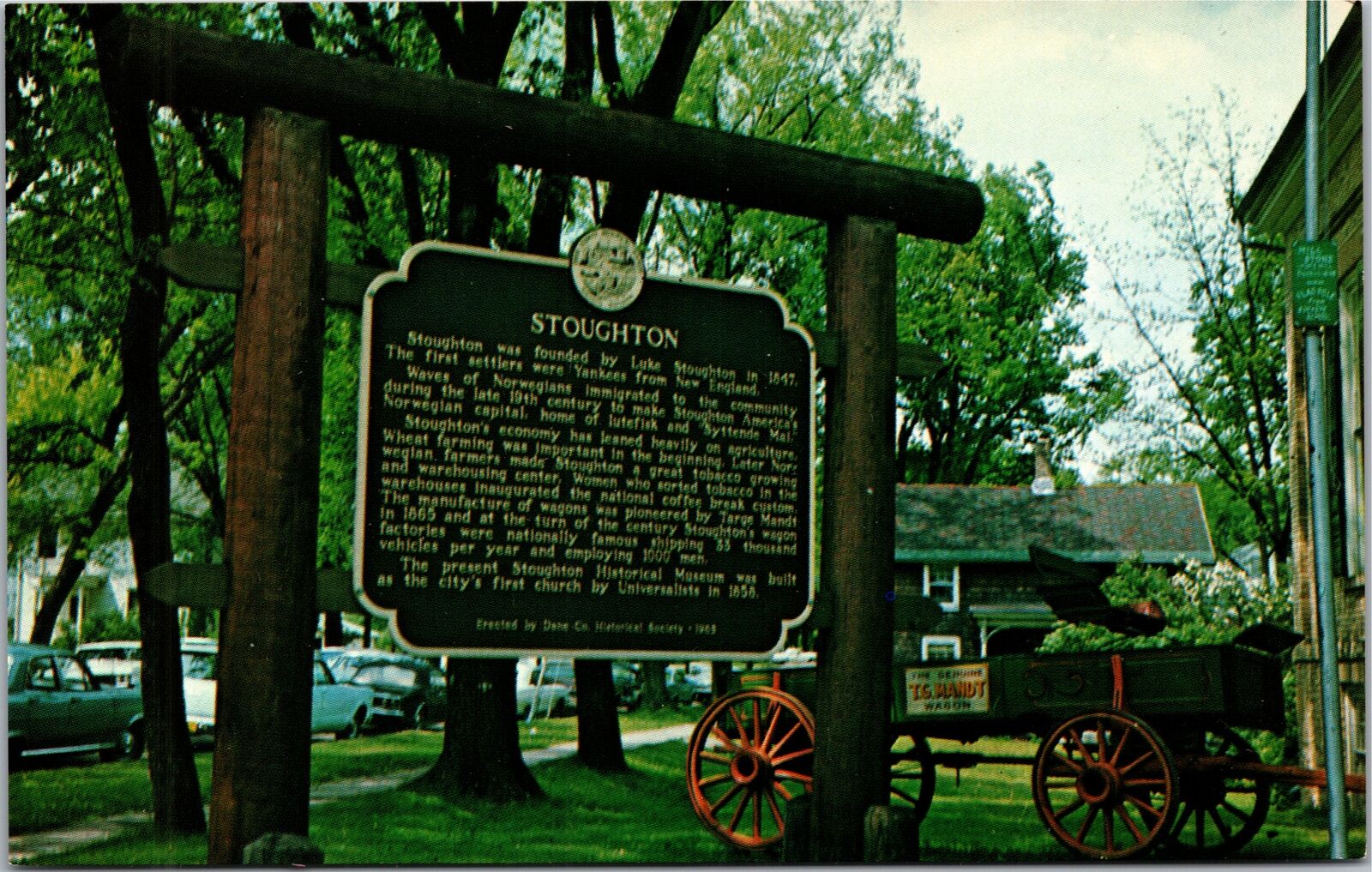 Postcard WI  Stoughton Wisconsin sign with wagon