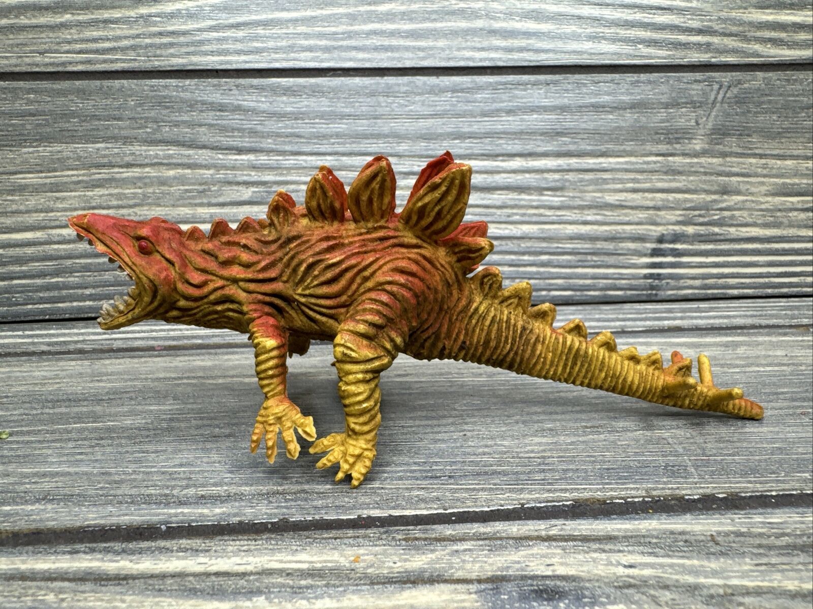 Vintage Plastic Figure Dinosaur Orange Yellow Stegosaurus 2.5” Made in Hong Kong