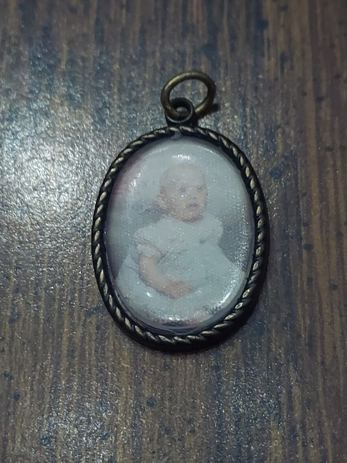 Two miniature vintage child pendants 