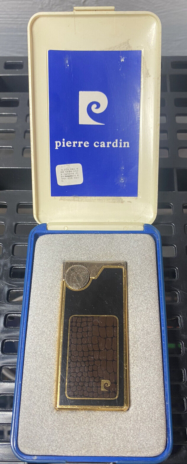 Vintage Pierre Cardin Gold Comet Lighter with Plastic Case.