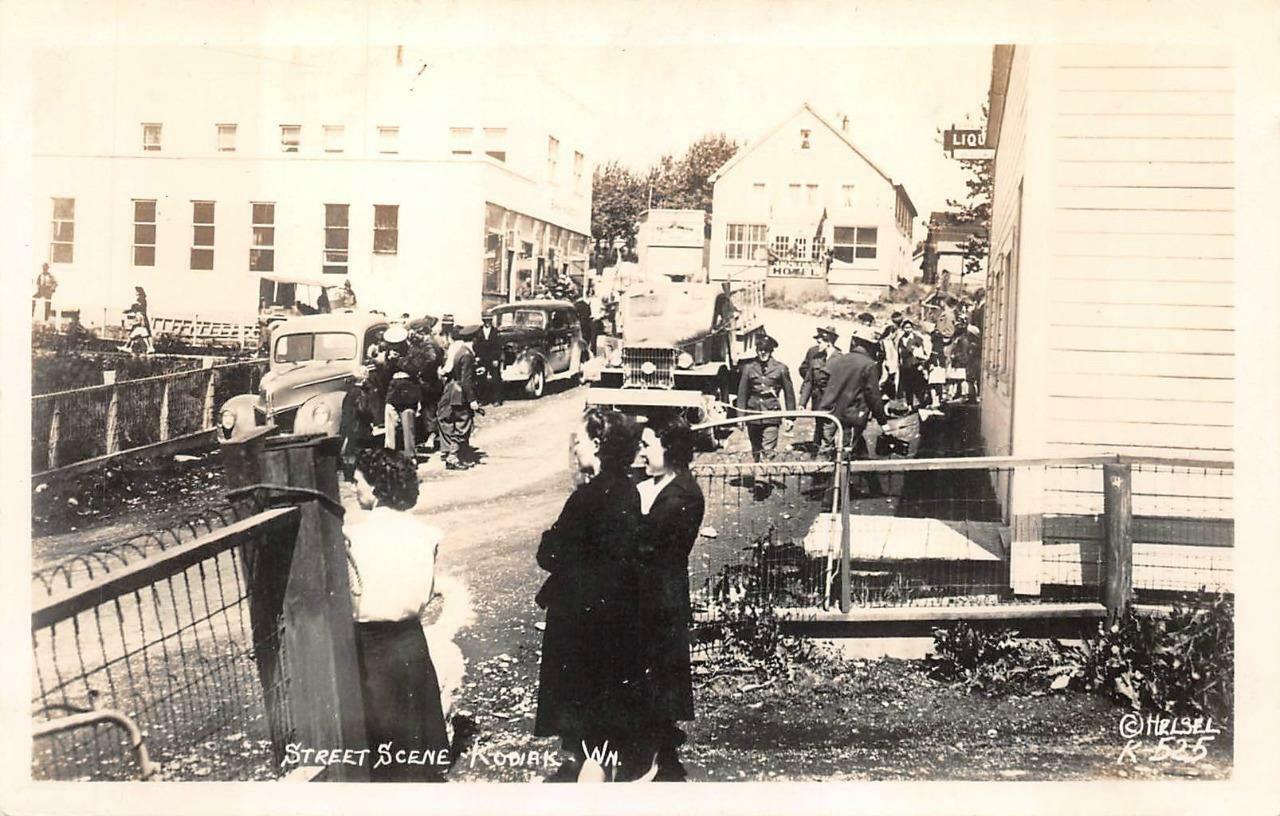 RPPC STREET SCENE KODIAK ALASKA CARS & SIGNAGE REAL PHOTO POSTCARD (c. 1940s)