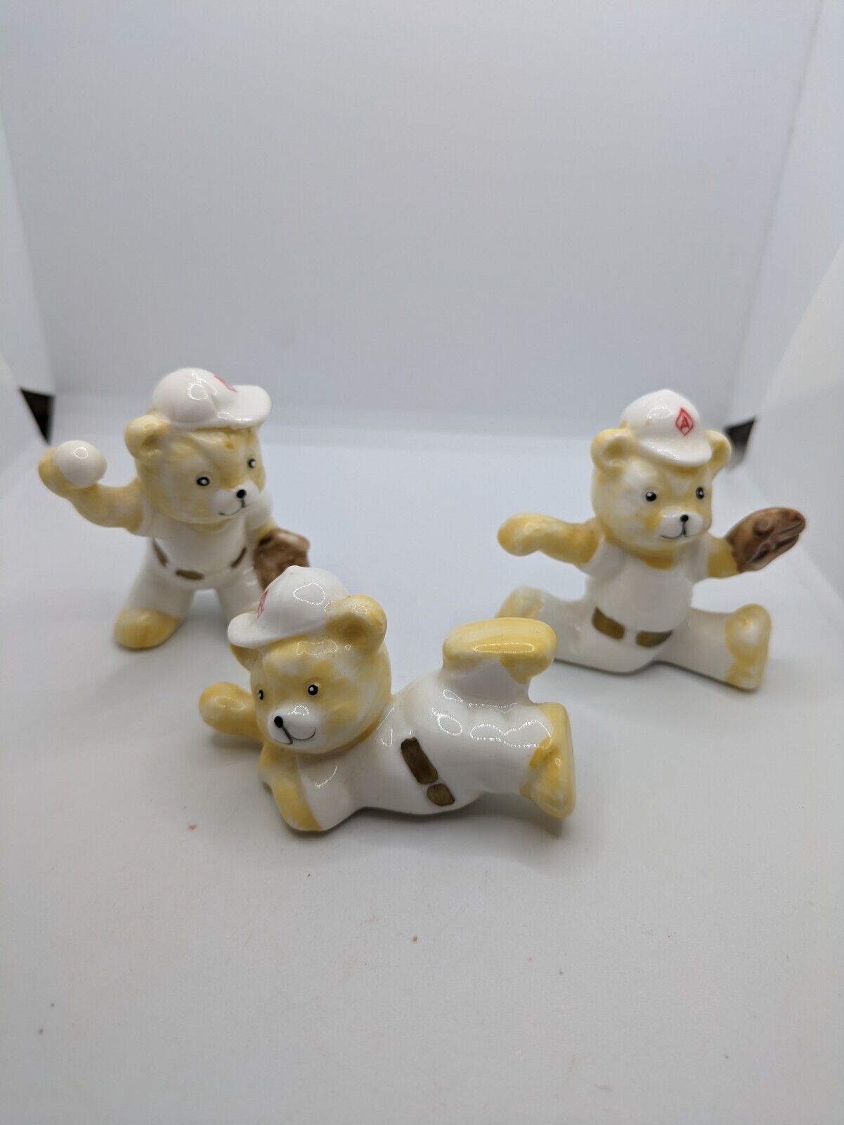 Three Miniature Porcelain Bear Figurines Playing Baseball-Ex Cond