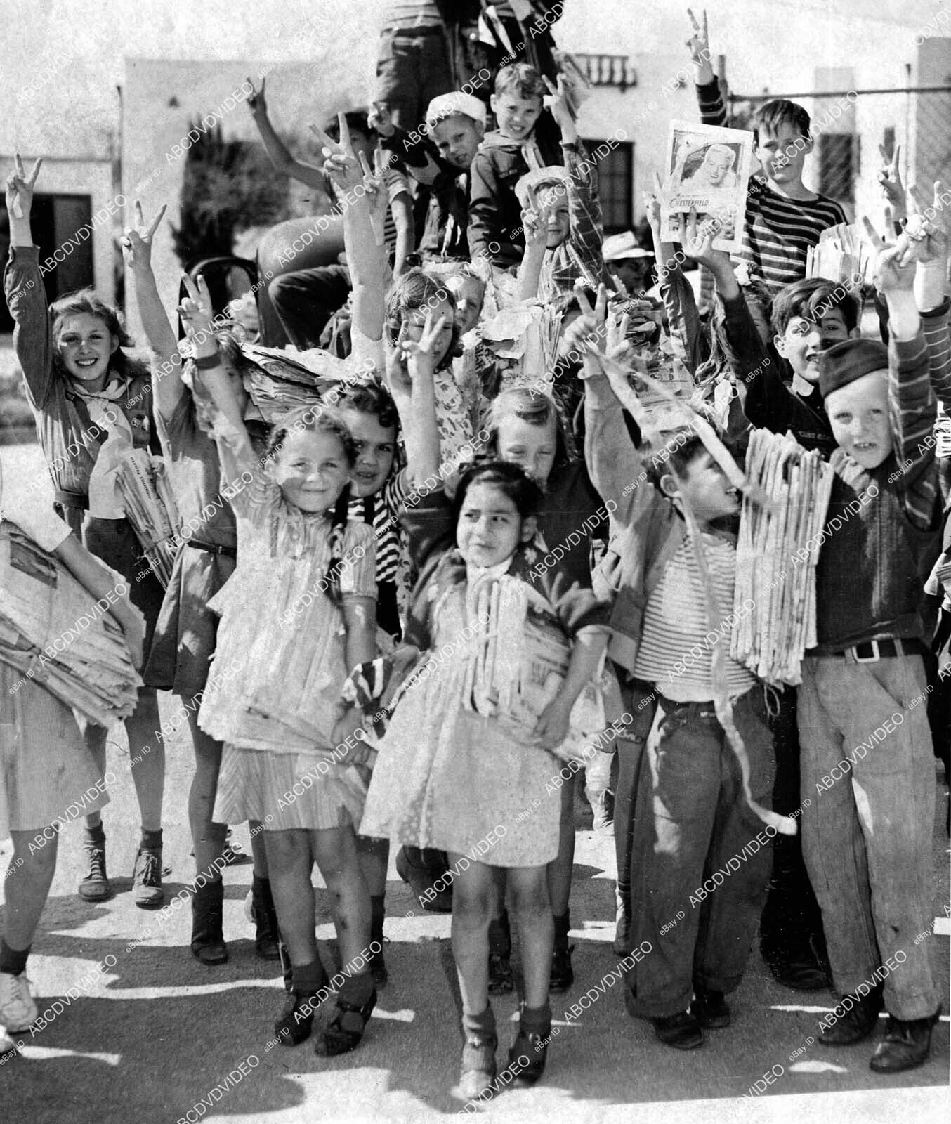 crp-40797 1940\'s WWII war effort scrap paper drive children celebrate success in