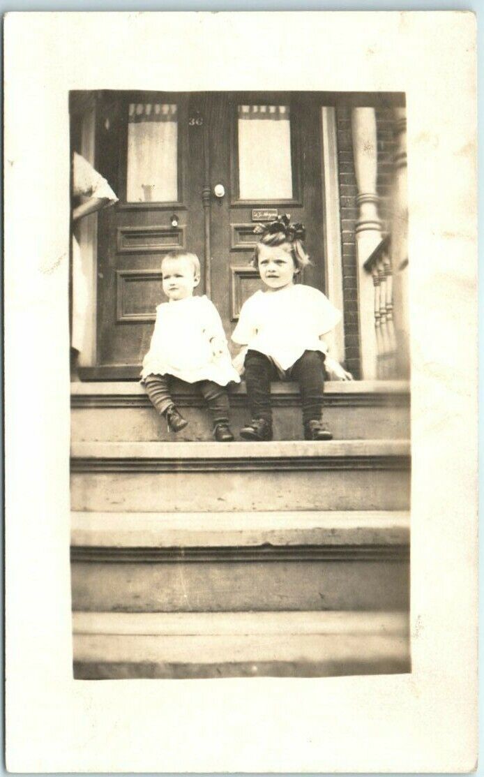 Postcard - Two children sitting at the stairs