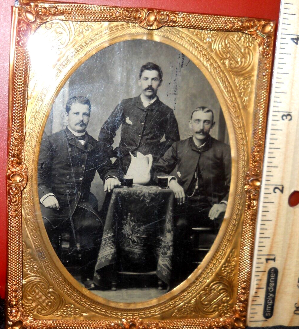 Quarter plate size Tintype of three young men in brass mat/frame
