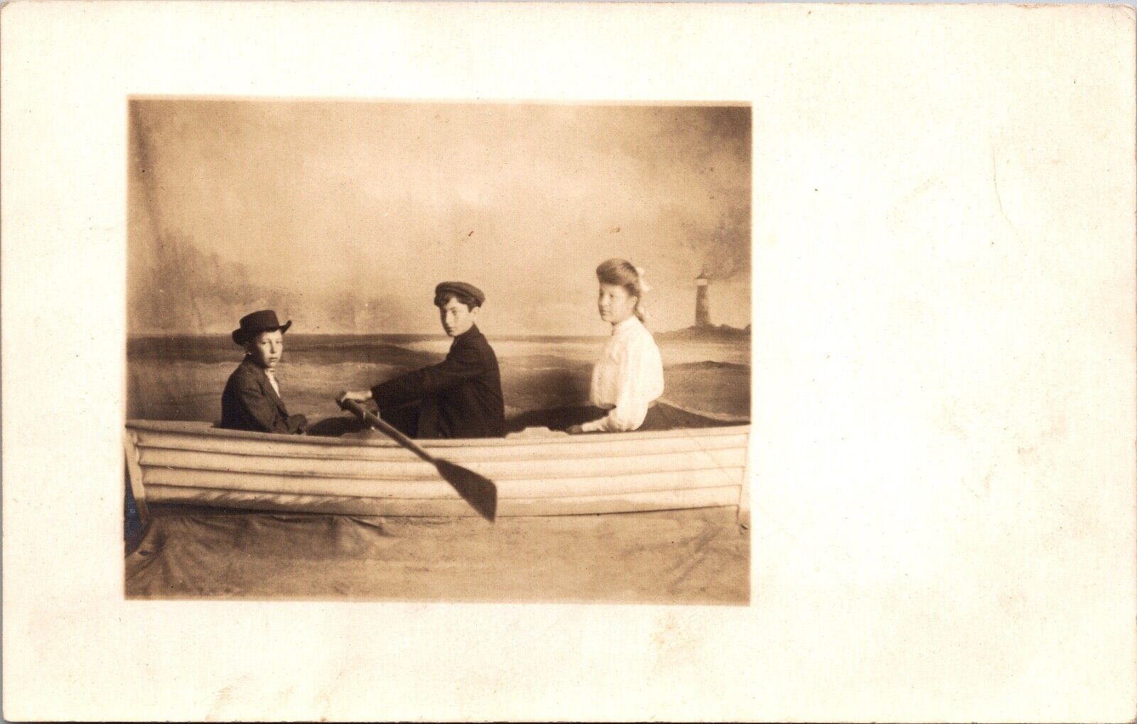 Real Photo Postcard Children in a Row Boat in a Photo Studio