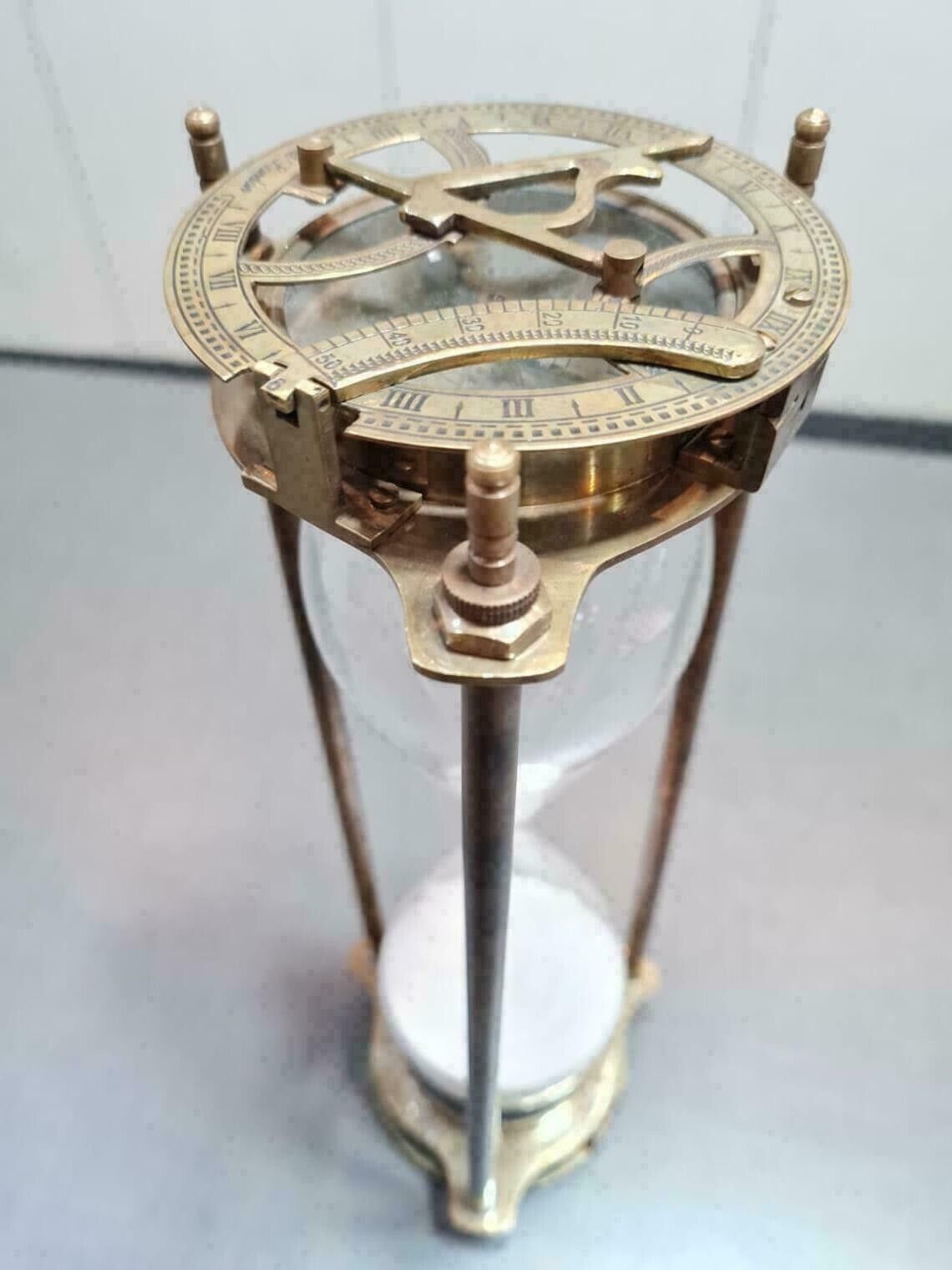 vintage maritime brass sand timer hourglass with sundial compass on top