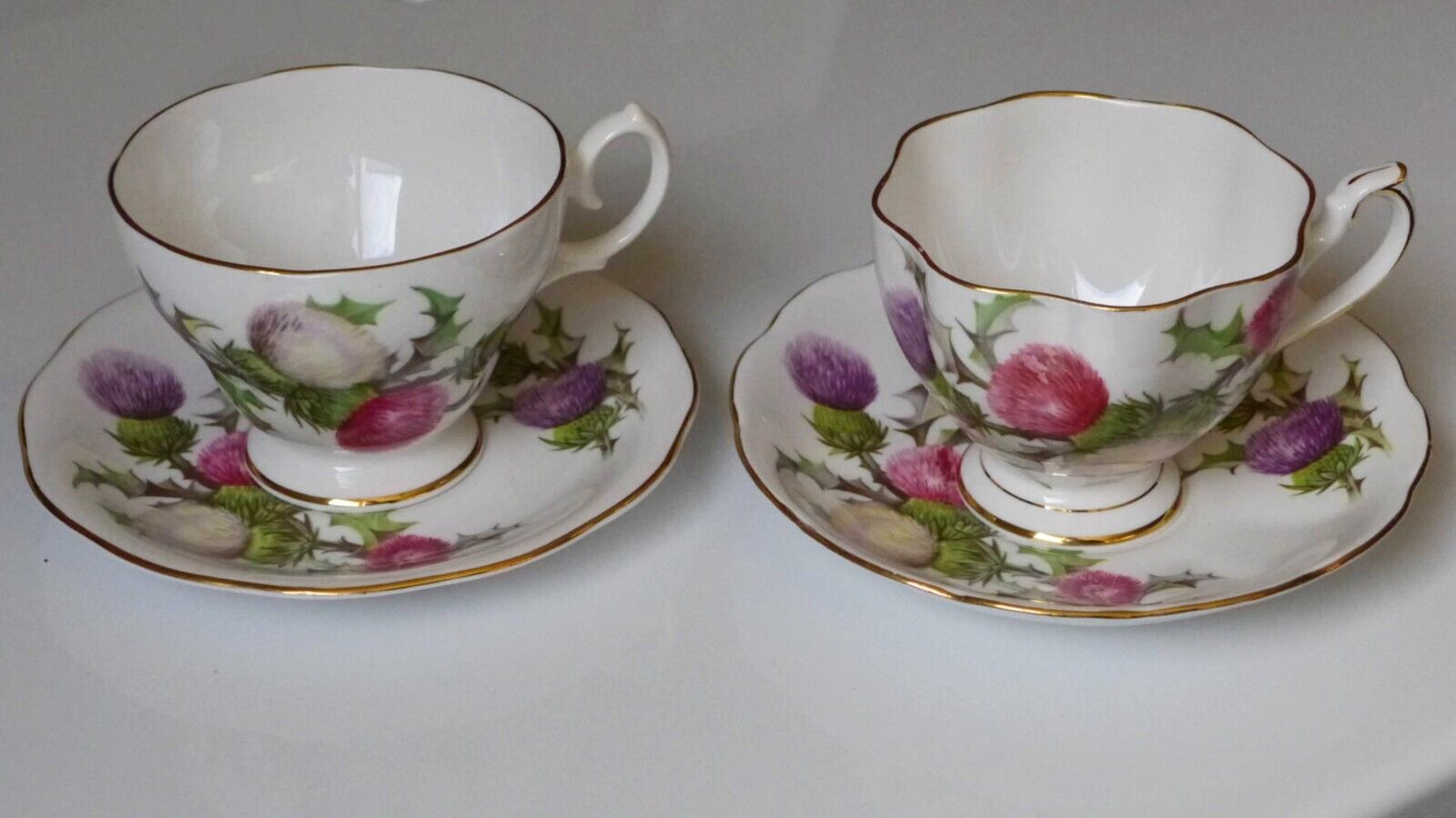 Two Queen Anne Dundee Thistle bone china cup and saucer sets