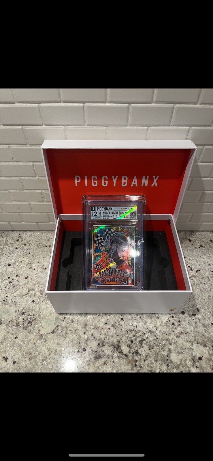 Piggy Banx Cards 1/1 Nipsey Hussle Red/ Blue/ Yellow - The Marathon Continues 