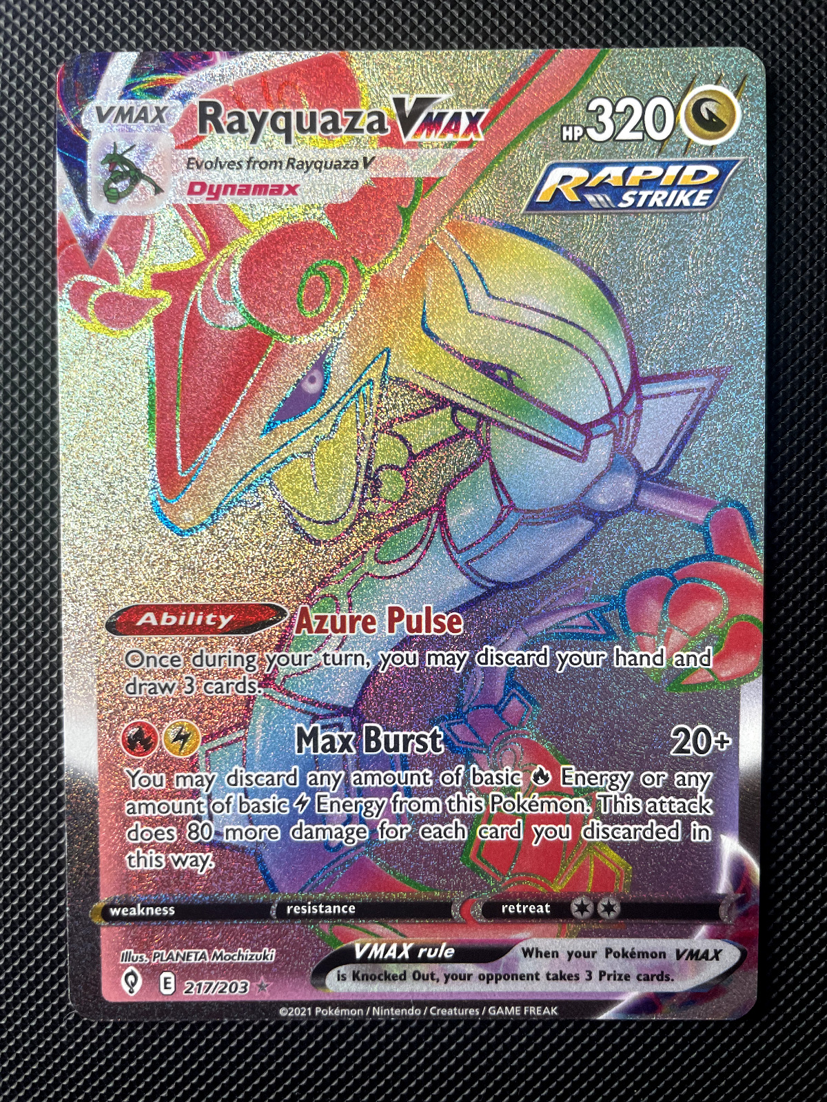 Pokemon Card Evolving Skies 217/203 Rayquaza VMax Rainbow Rare