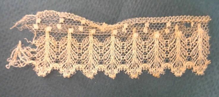 1848 antique NET LACE TRIM PIECE found in EARLY BOOK