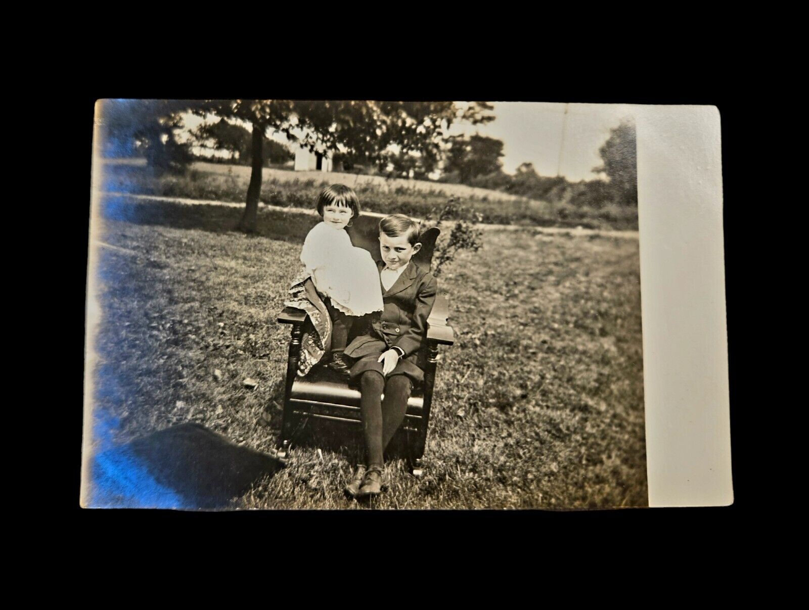 Antique Rppc Postcard Photograph Boy Girl Chair Outdoors