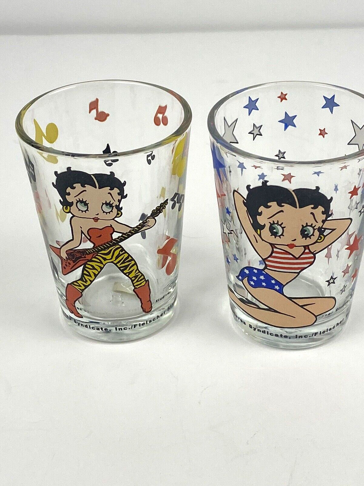 (2) vintage Betty Boop shot glasses 1998 Rockstar and Flag outfit Kings Features