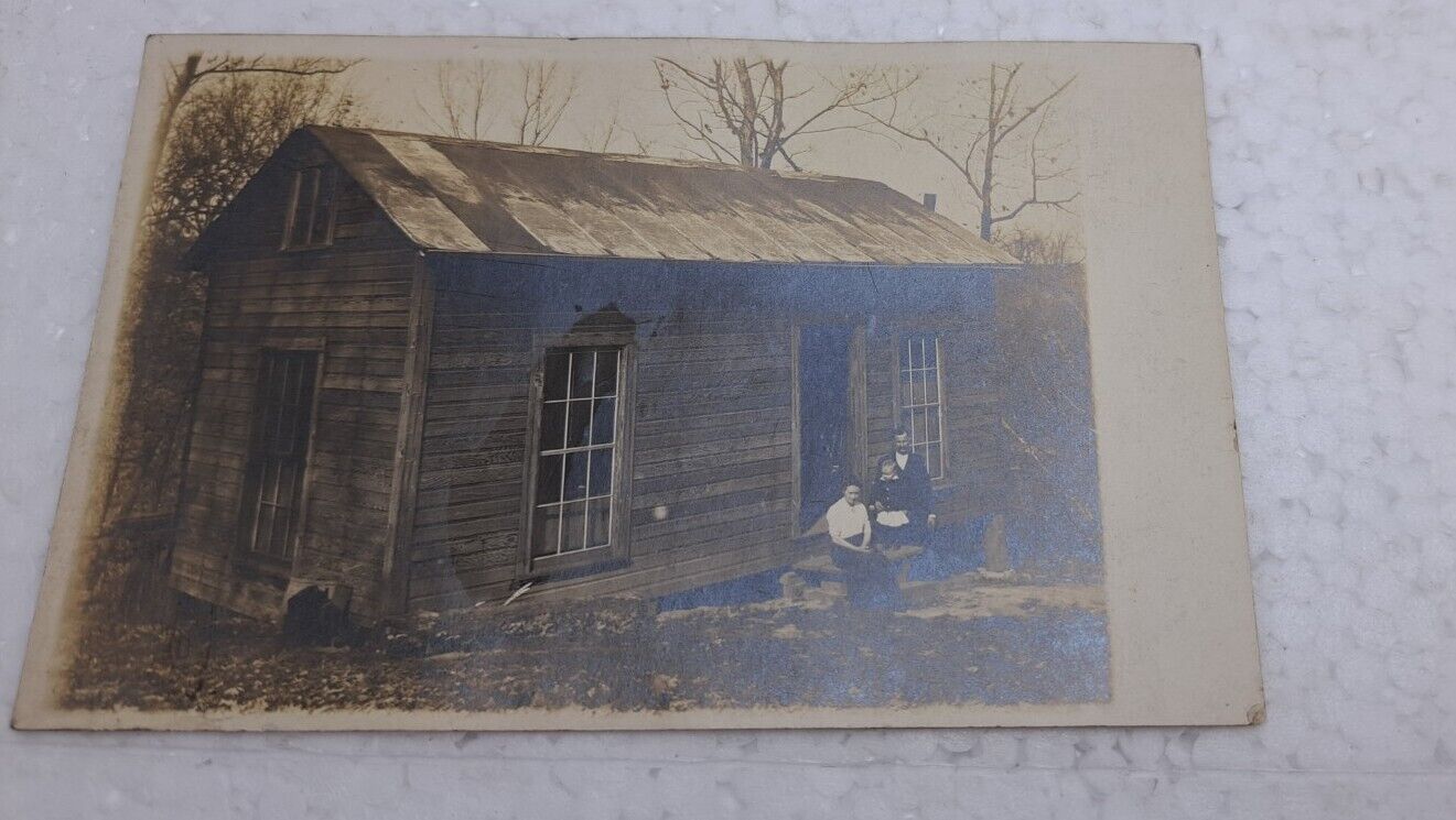 Antique RPPC Postcard Man Woman Sitting On Stoop Of Small House