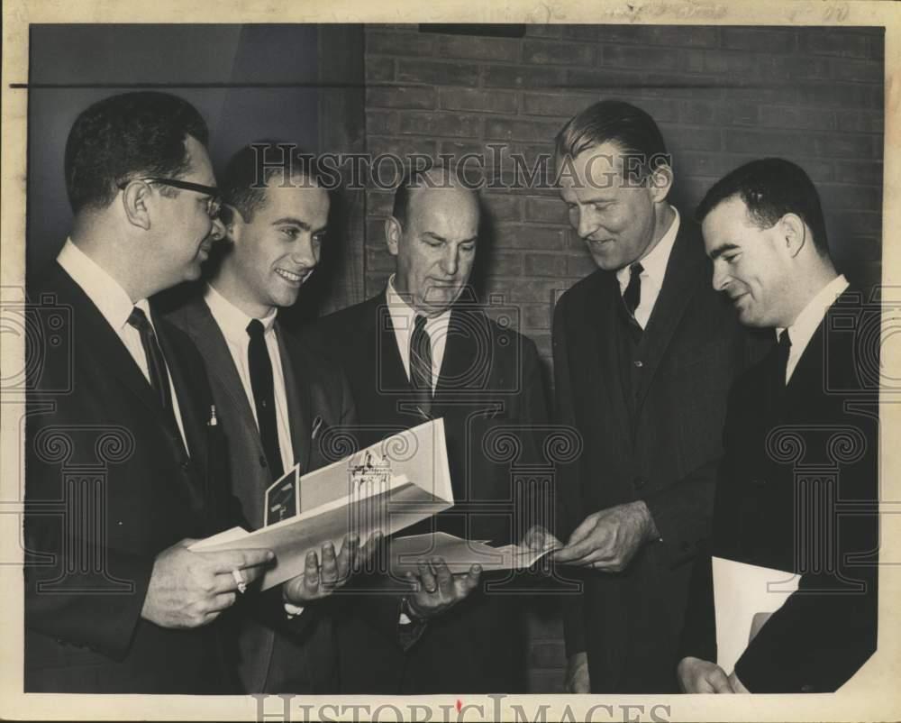 1966 Press Photo Store managers look over brochures for Colonie, New York mall