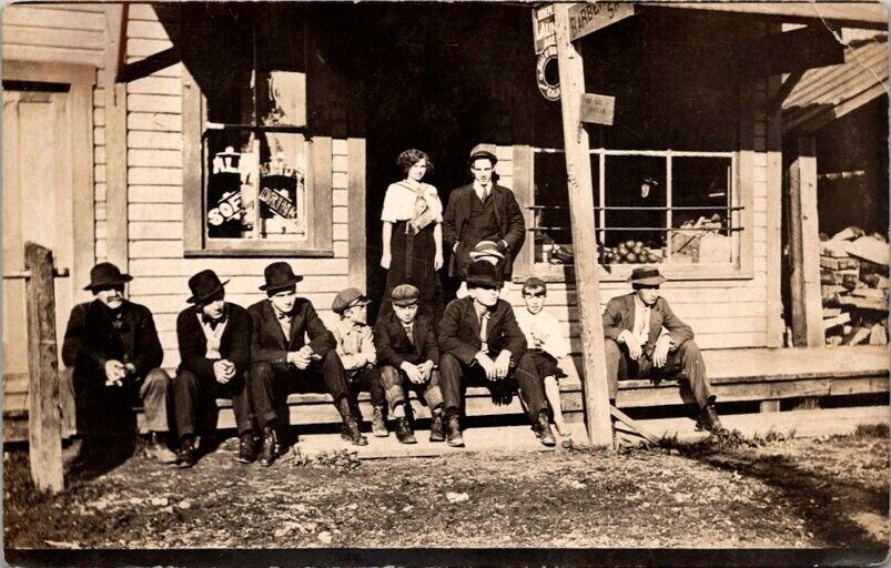 RPPC Postcard Men and Woman on Porch of Local General Store c.1907-1914    12556