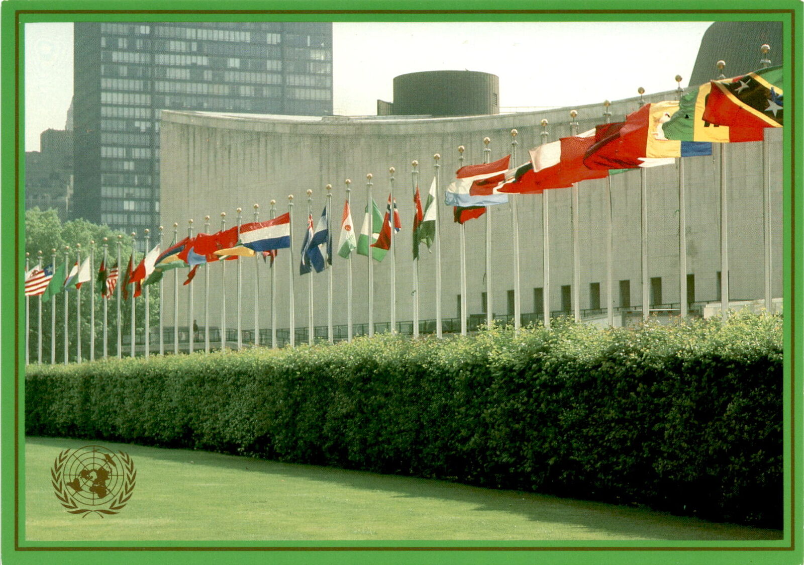 United Nations postcard with member states\' flags. Valued at 15 cents.