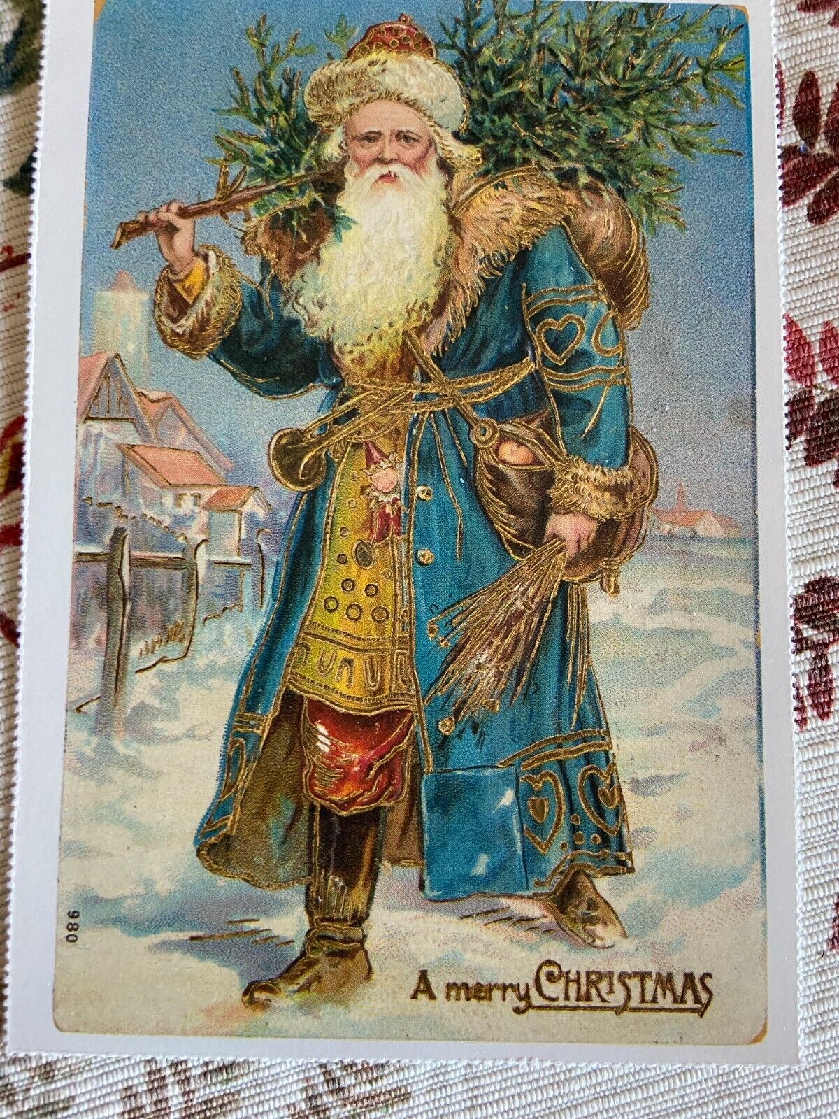 vintage Christmas postcard old World Santa blue coat snow scene reproduced