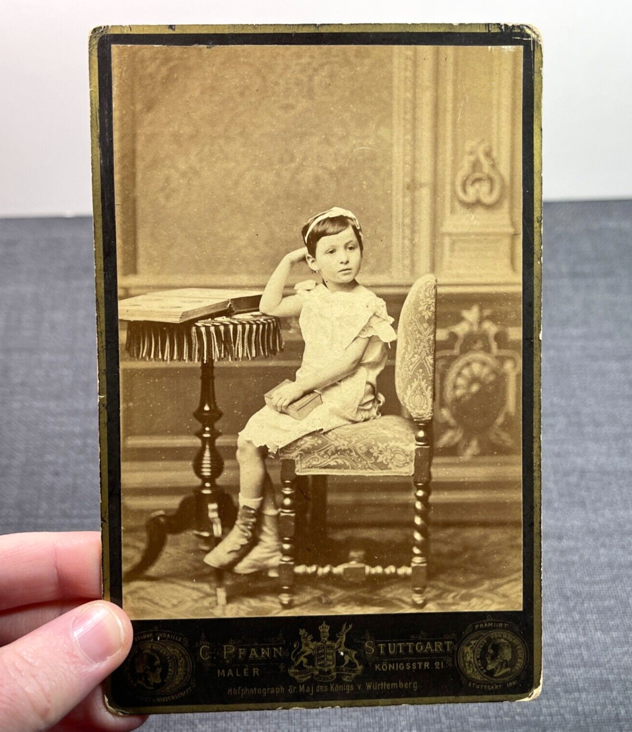 Antique Cabinet Card Photo German Stuttgart Girl Sitting at Table Holding Book
