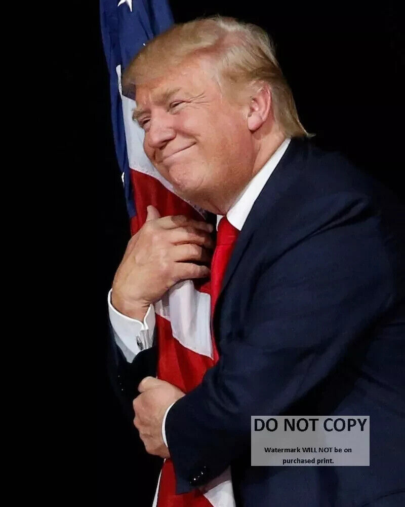 11X14 PHOTO - DONALD TRUMP HUGGING THE AMERICAN FLAG IN 2016 (CP-027)