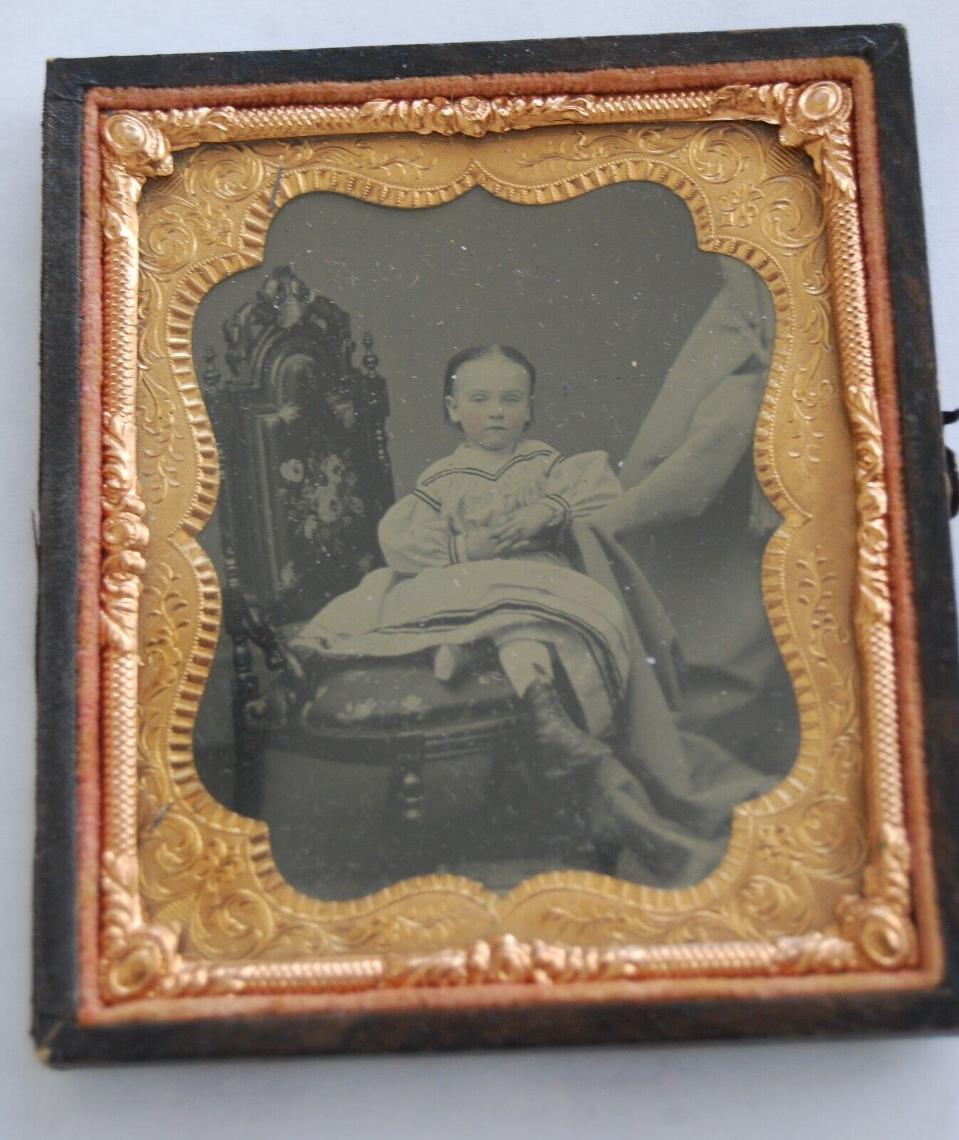 Postmortem tintype of a little girl with HIDDEN MOTHER