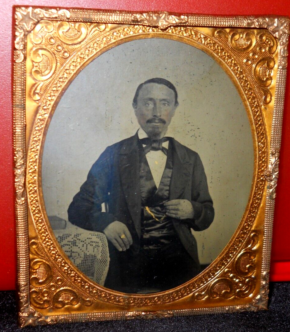 1/6th size Tintype of man in brass mat/frame