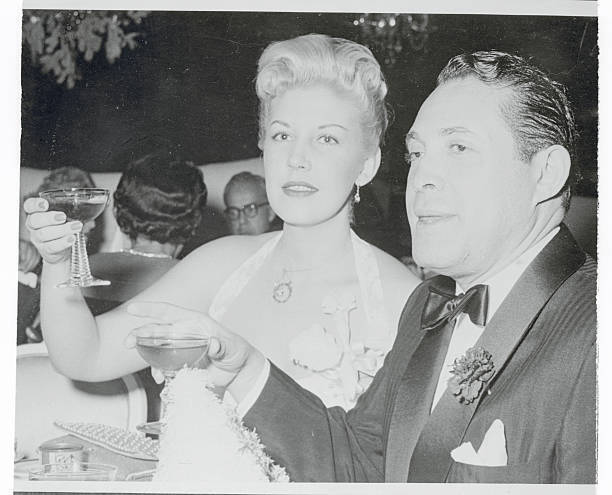Serge Rubinstein and Betty Reed Making to a Toast 1955 Photo