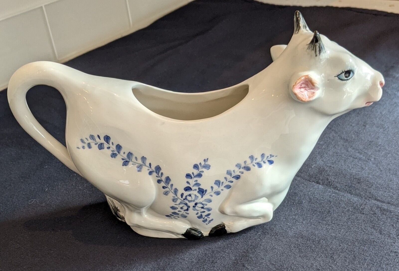 Vintage hand-painted pitcher shaped like a cow (Revlon cosmetics connection)