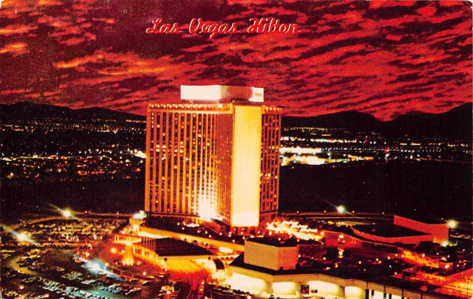 Las Vegas NV Nevada Hilton Hotel Casino Skyline Night View Vtg Postcard C21