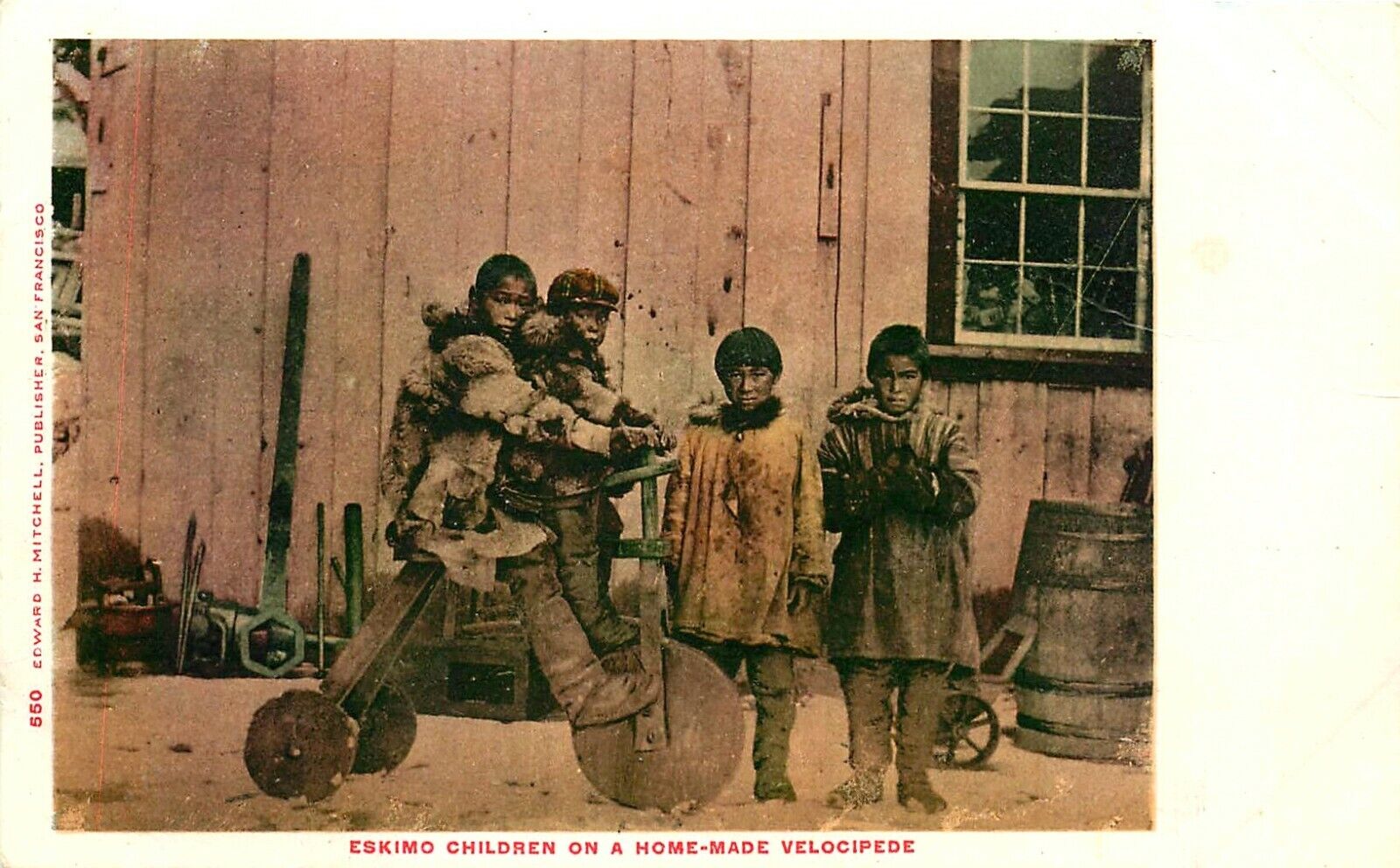 ESKIMO CHILDREN ON HOME MADE VELOCIPEDE, BICYCLE, c 1905 VINTAGE POSTCARD ALASKA