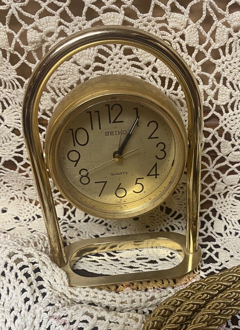 Clock Seiko Quartz Brass Gold Rotating Table Clock model qqp171a. Vintage