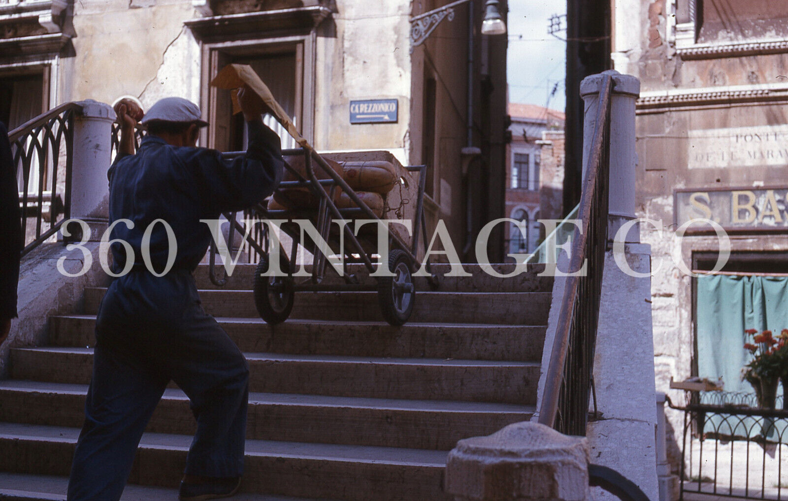 Vintage 1963 Kodachrome 35mm photo slide man wheeling cheese & meat in Italy