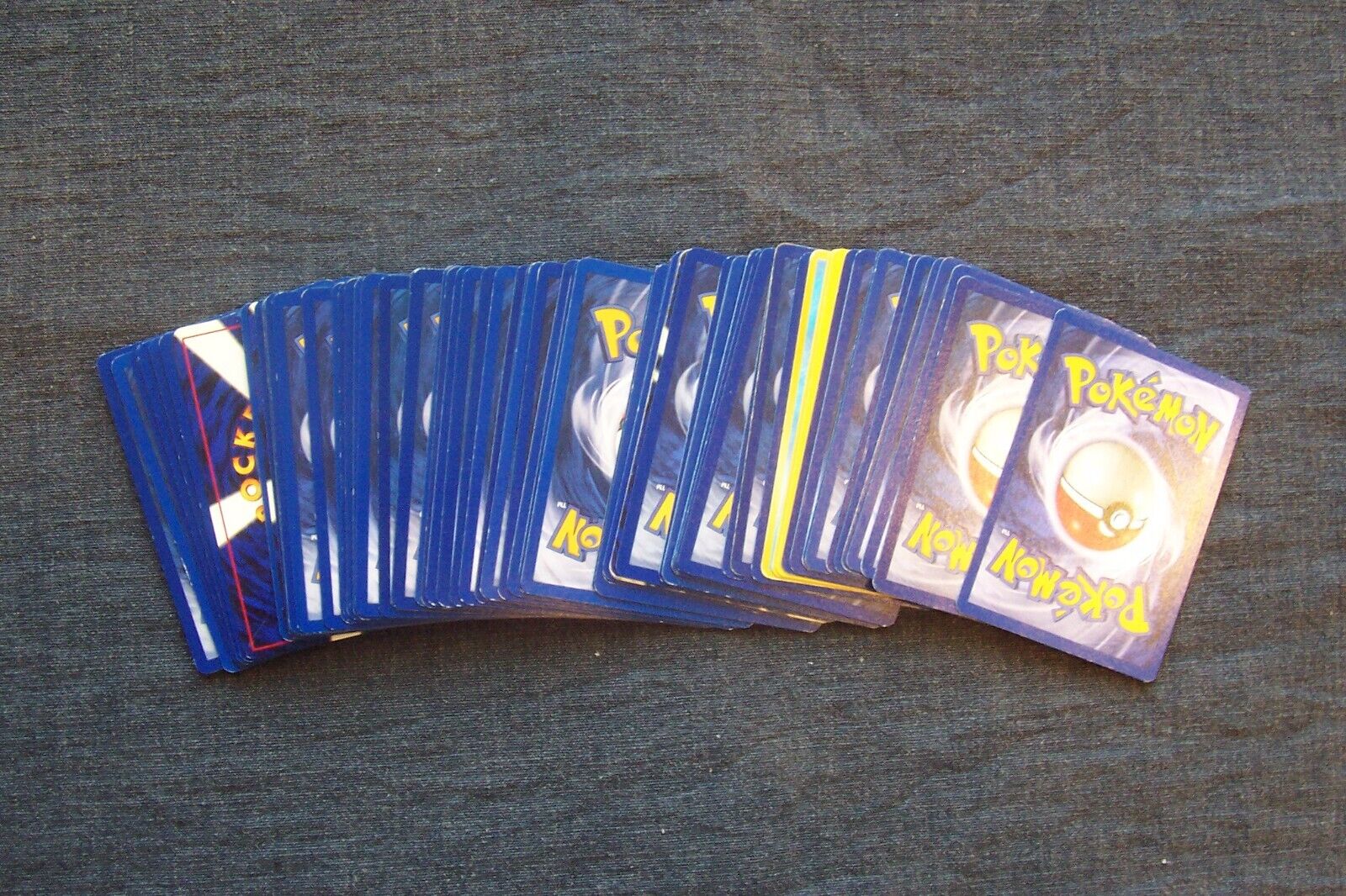 Here is a lot of 76 Pokémon cards - all in excellent condition, value unknown