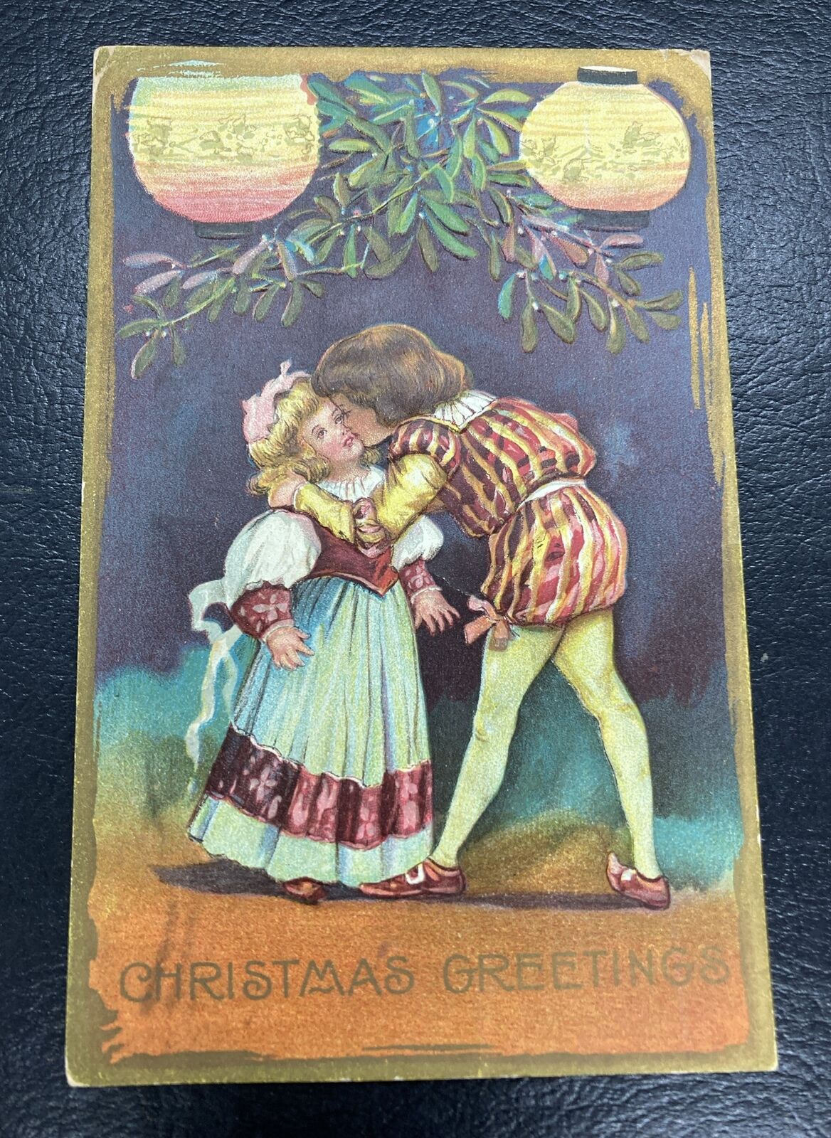 Vtg Embossed Postcard Christmas Greeting Kissing Kids Scene Cute Lanterns 1909