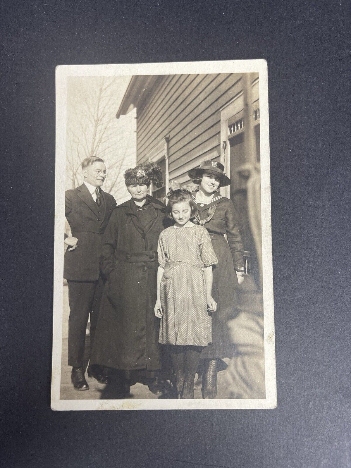 RPPC of Family Photo Father, Mother, And Two Daughters On Side Of House