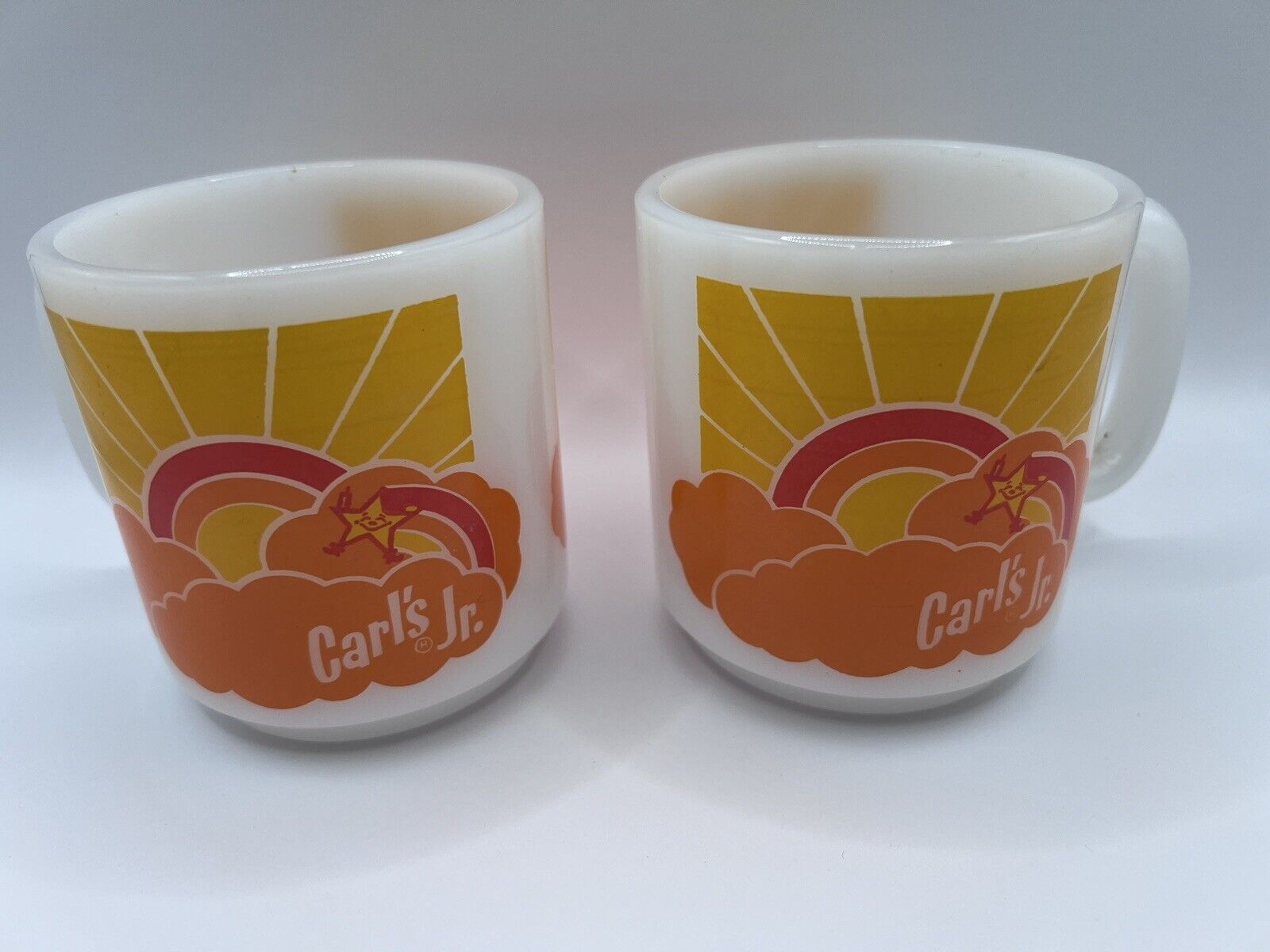 Vintage Carl\'s Jr Happy Star Sunrise Coffee Mug’s Glasbake 1970\'s, Set of 2