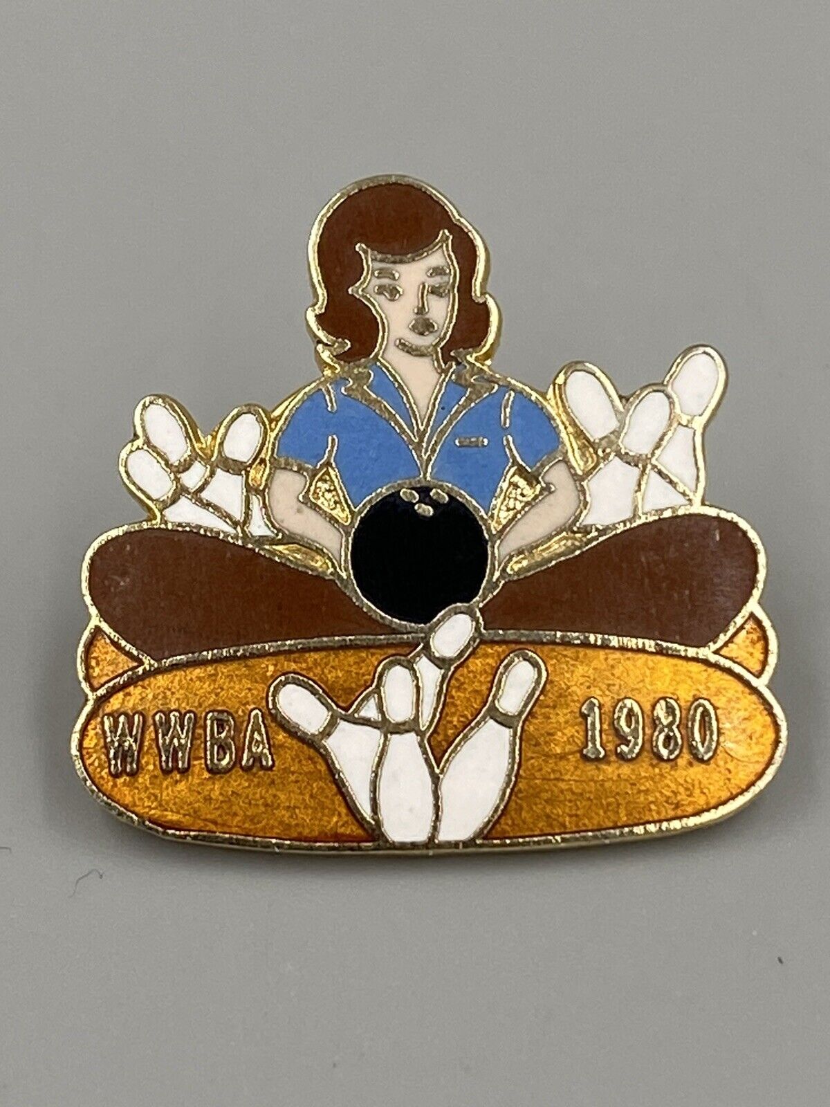 Vintage WWBA 1980 PIn of Woman Surrounded by Bowling Pins Lapel Pin