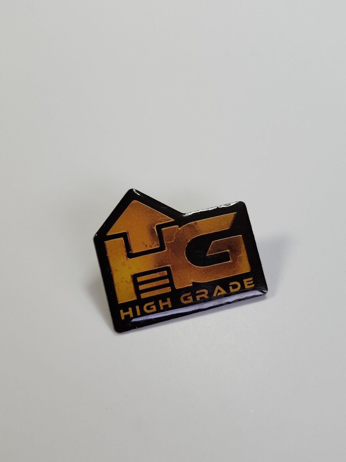 HG High Grade Lapel Pin