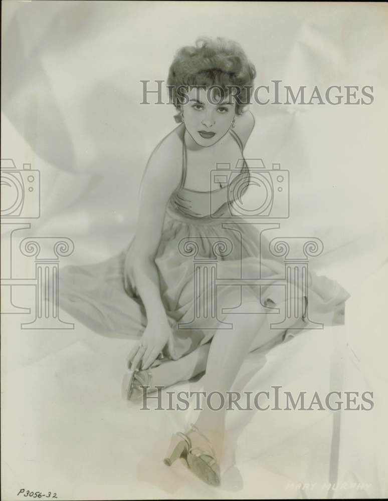 1955 Press Photo Movie Actress Mary Murphy Posing On Fabric In Sultry Dress