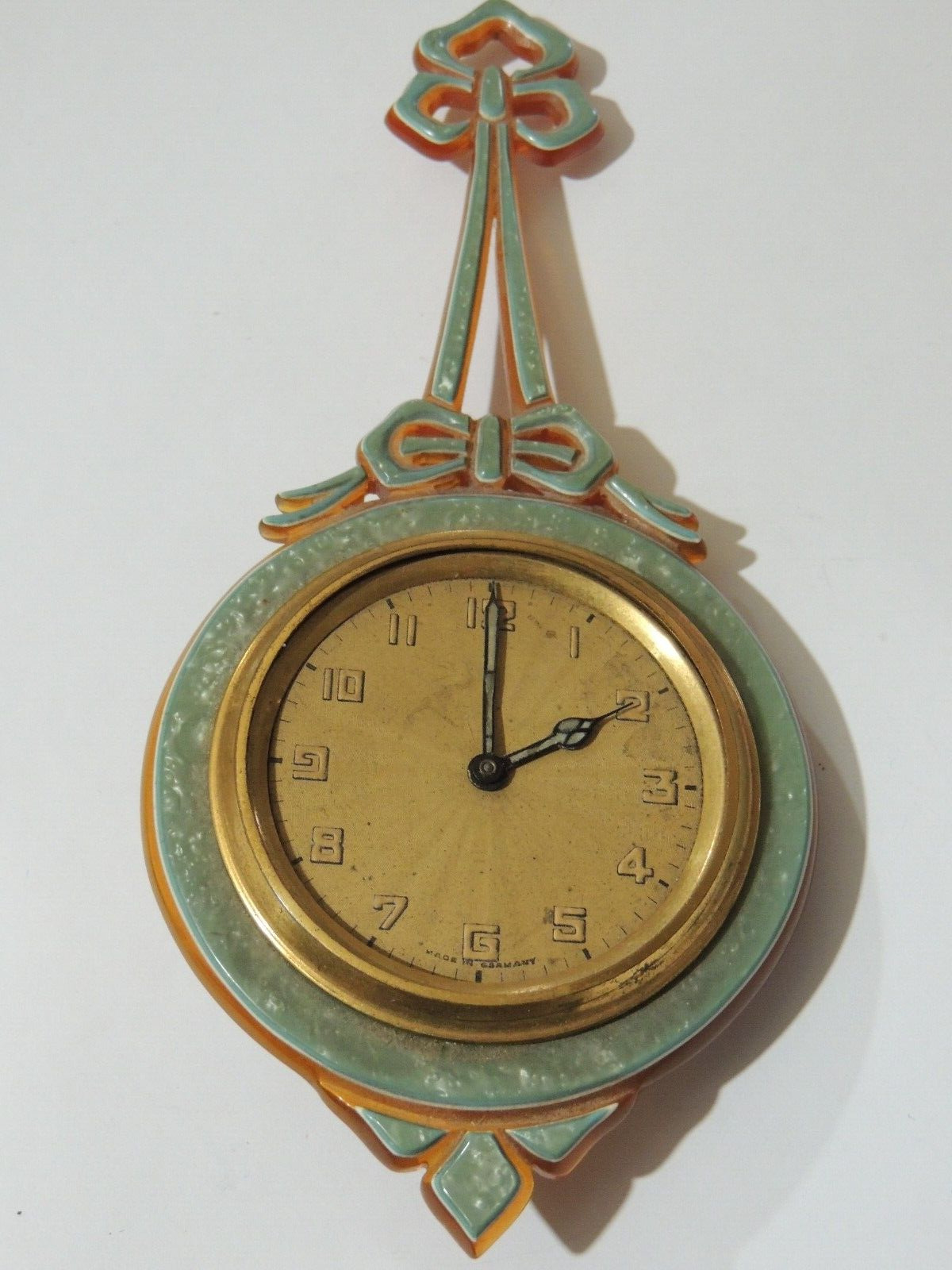 VINTAGE SMALL WINDUP HANGING KIENZLE GERMAN CLOCK WITH CELLULOID SURROUND WORKS