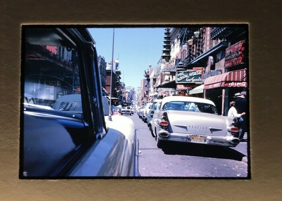 1960\'s China town cars street scene Rear Pontiac