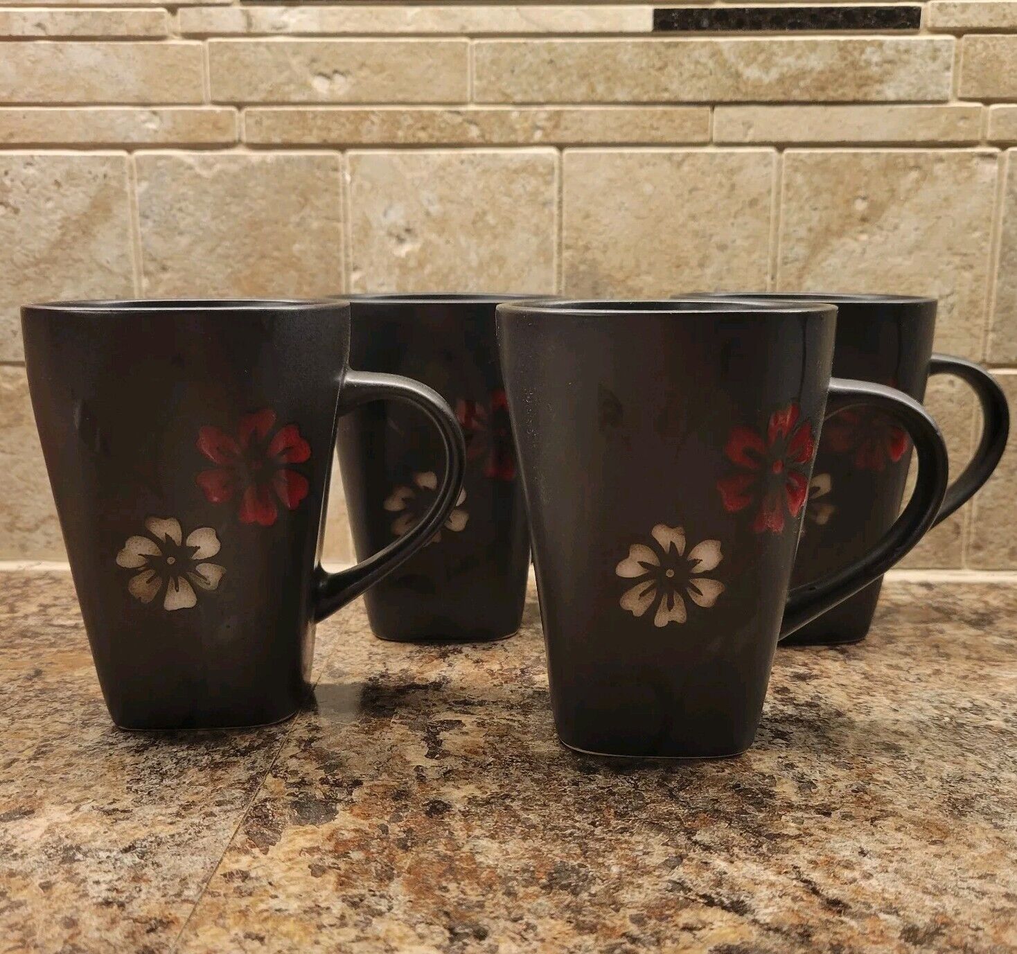 Gibson Elite Mugs “Evening Blossom” Black w/red & white flower, set of 4
