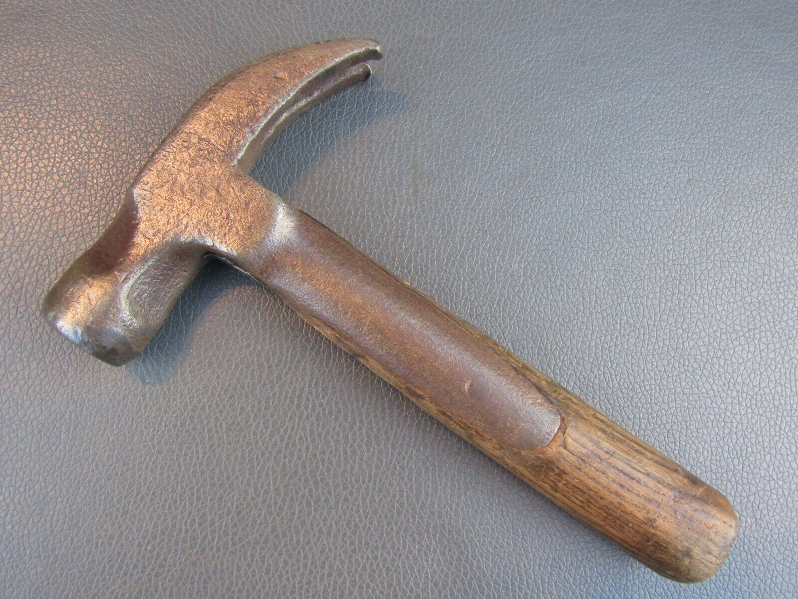 Vintage strapped claw hammer old tool