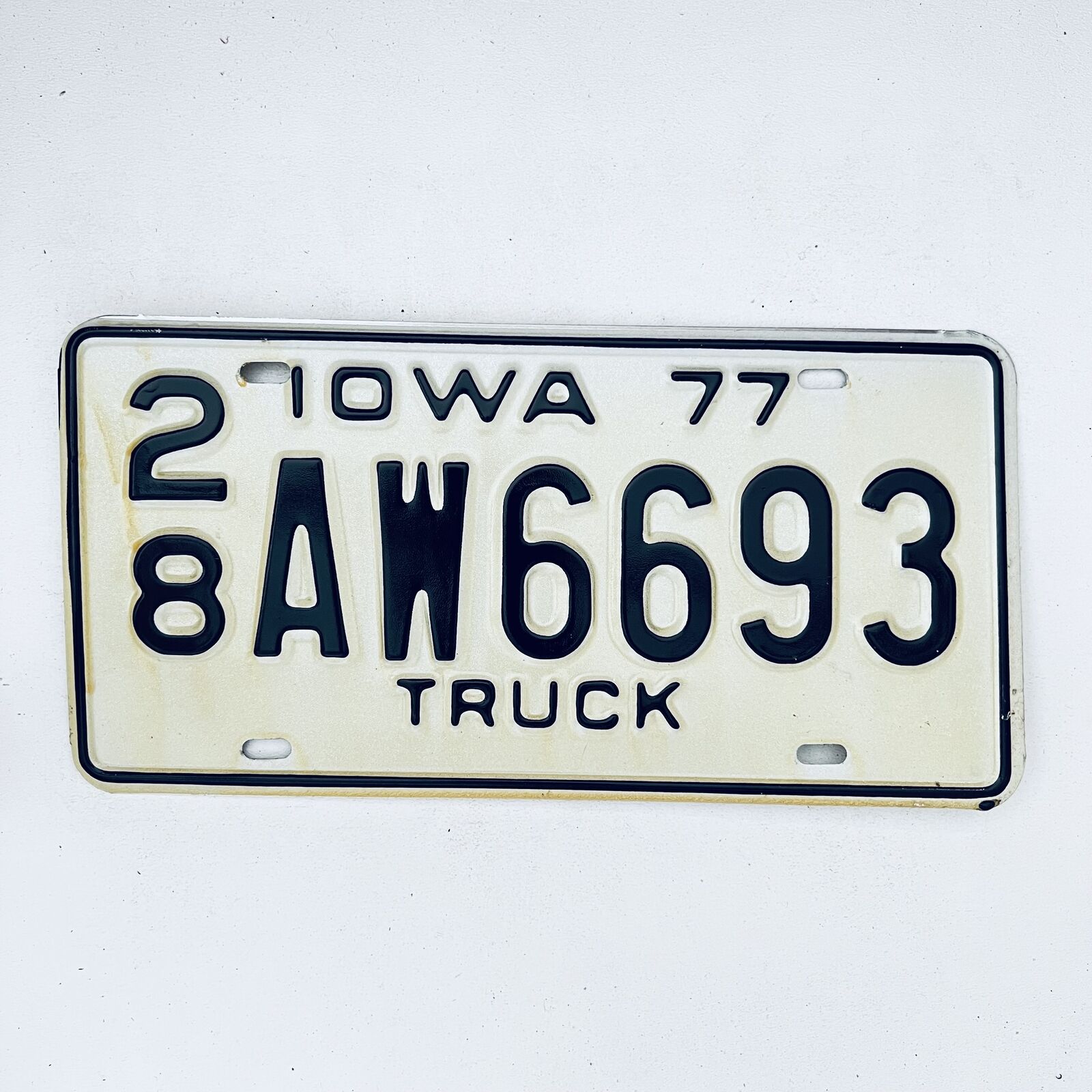 1977 United States Iowa Delaware County Passenger License Plate 28 AW6693