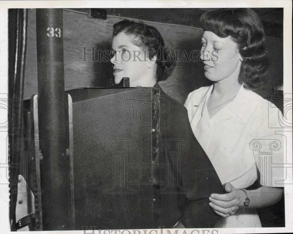 1949 Press Photo Irene Van Kempen helps Mary Manning in x-ray procedure, Boston