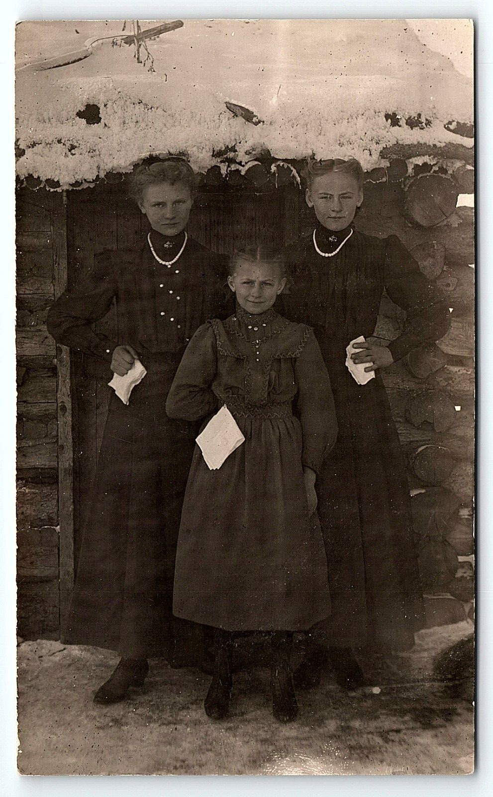 c1910 YOUNG LADIES POSING IN FRONT OF SNOW COVERED LOG CABIN RPPC POSTCARD P3662