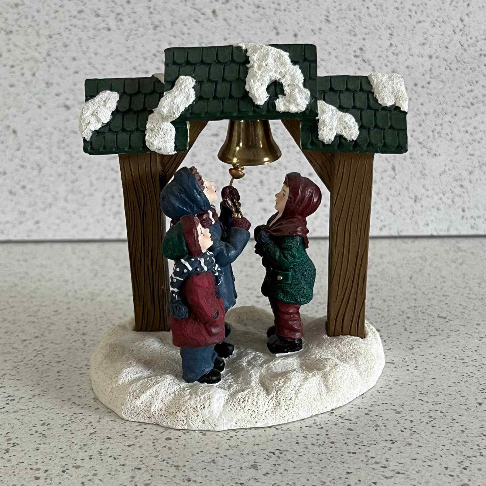 Mervyn\'s Village Square Children Ringing A Bell 1996 Figurine Holiday Christmas