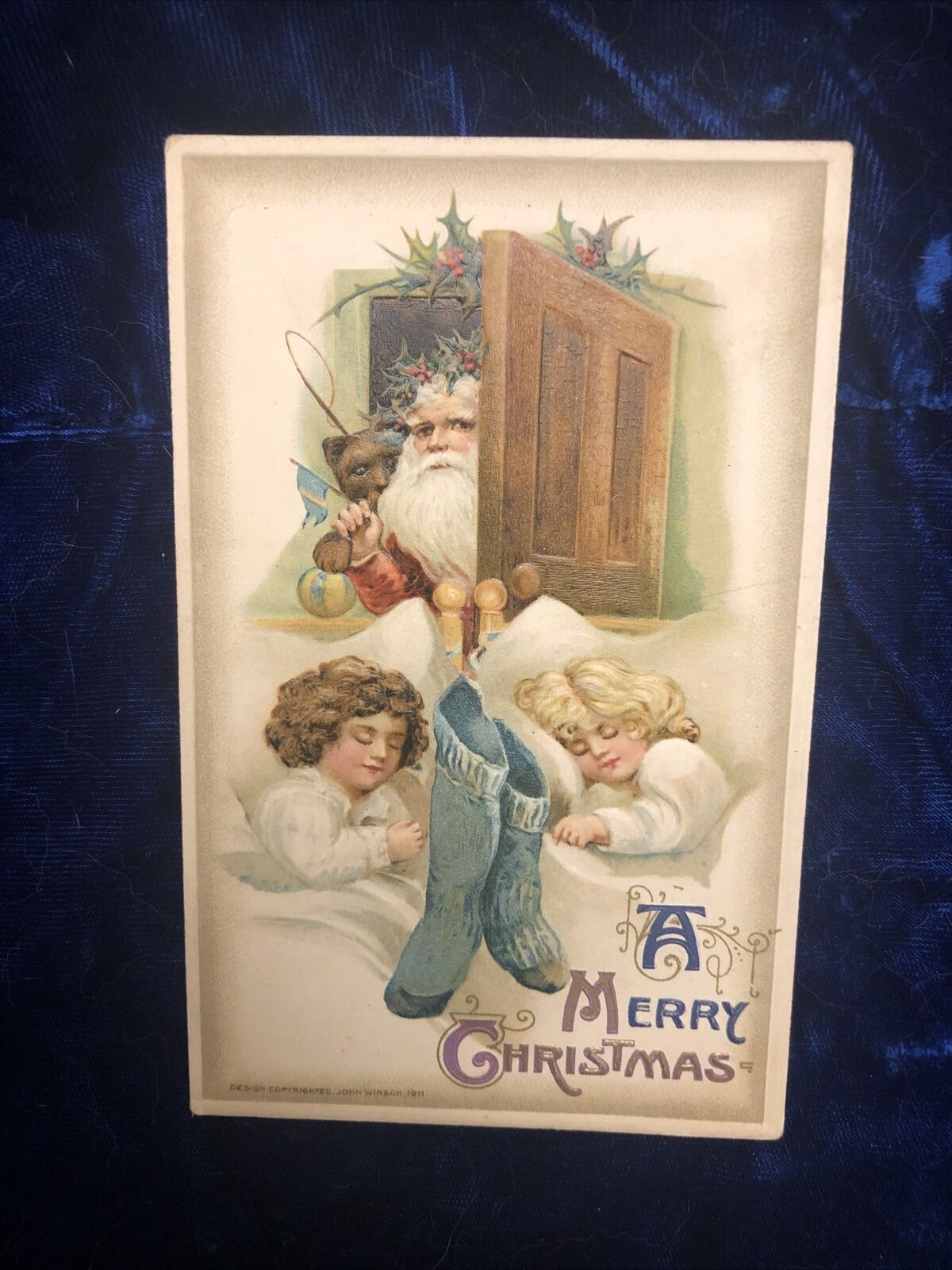 1911 MERRY CHRISTMAS PC  Pub By JOHN WINSCH-w GIRLS Sleeping And Santa in Door